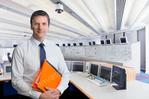 Preview: Technician In Control Room Of Nuclear Power Station