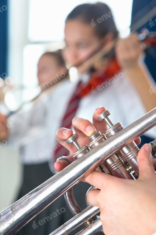 Preview: Vertical Close-Up Of A High School Student Playing Trumpet During A Music Class.