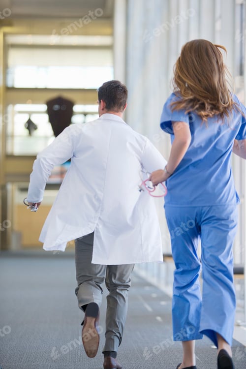Preview: Doctor And Nurse Running Down The Hospital Corridor