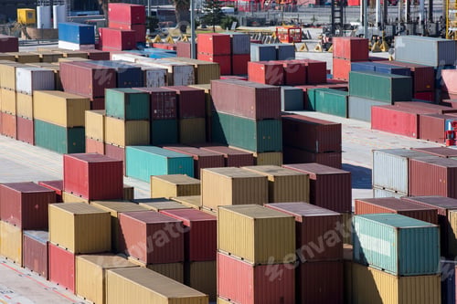 Preview: Wide Shot Of Multicolored Cargo Containers Stacked At A Commercial Dock.