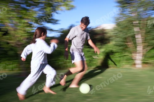 Preview: Father And Daughter Playing Football In Garden At Home With Action Motion Blur