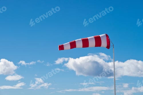 Preview: Wind Sock Blowing In Wind Against Blue Sky