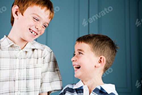 Preview: Older And Younger Boy Laughing Together