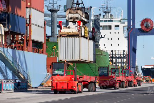 Preview: A Crane Loading Cargo Containers On A Truck At A Commercial Dock.