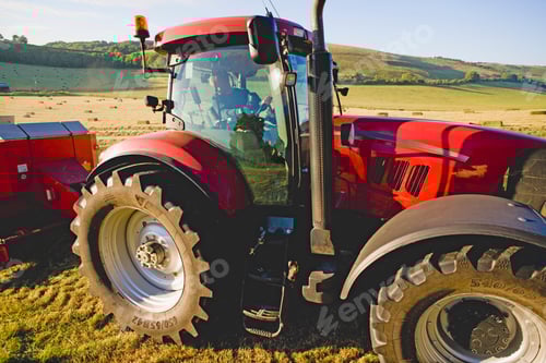 Preview: Close Up Of A Tractor Baling Hay In The Field