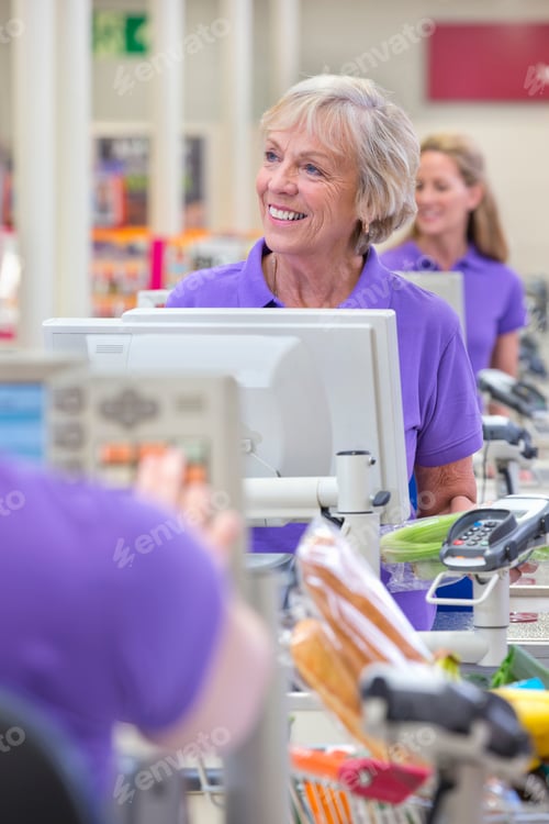 Preview: Portrait Of Cashier At Supermarket Checkout