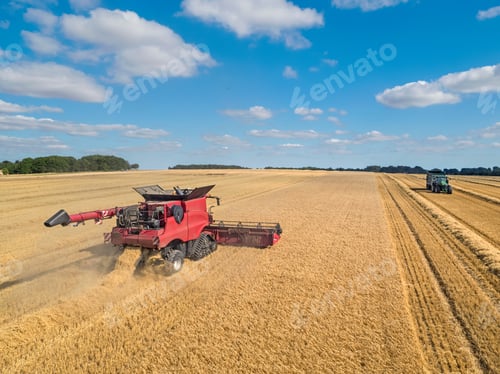 Preview: Harvest Aerial Of Combine Harvester Cutting Summer Barley Field Crop With Tractor Trailer Under