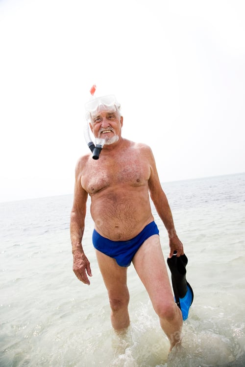 Preview: Senior Man With Snorkel Gear At The Beach