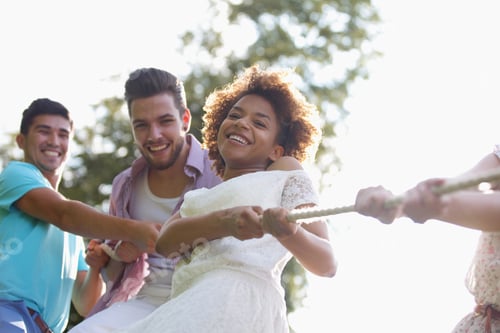 Preview: Low Angle View Of Young Couples Having Tug Of War Match