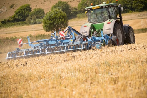 Preview: Rear View Of Tractor Ploughing Field Using Disc Plough