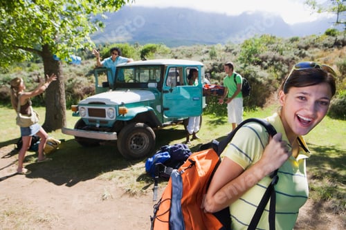 Preview: Group Of Young Adults On Road Trip Unloading Carin Countryside