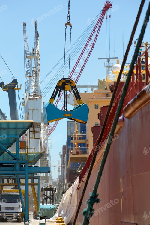 Preview: Wide Open Grab Bucket At A Commercial Dock