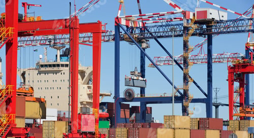 Preview: Wide Shot A Crane Lifting Cargo Containers At A Commercial Dockyard.