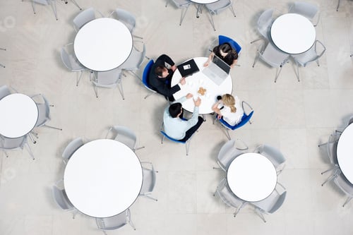 Preview: Overhead View Of Informal Business Meeting At Table Of Staff Canteen