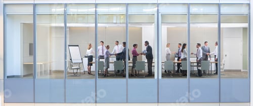 Preview: Wide Shot Through An Office Window With Business People Shaking Hands With Each Other.
