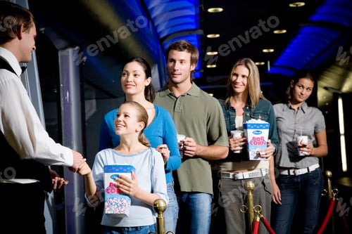 Preview: Usher With Queue Of People At The Cinema