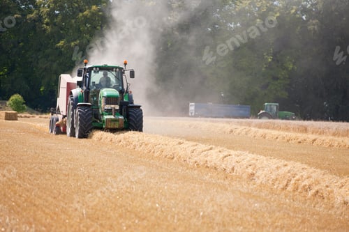 Preview: Rural Farm With A Tractor Baling Straw Over The Field.