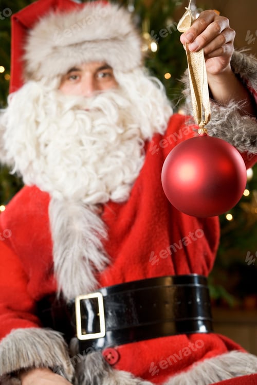Preview: Father Christmas Or Santa Claus Holding A Bauble