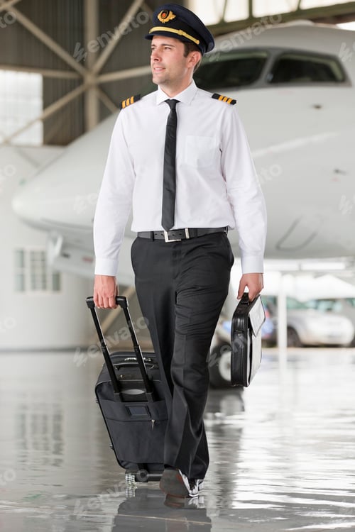 Preview: Pilot Walking Away From Private Jet With Suitcase