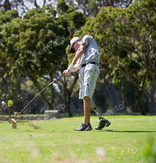 Preview: Male Golfer With Artificial Leg Teeing Off On Golf Course