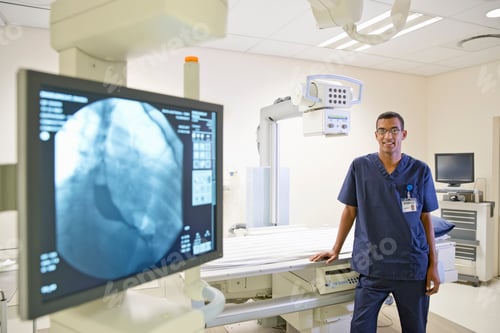 Preview: Portrait Of Male Radiographer In Hospital X Ray Department