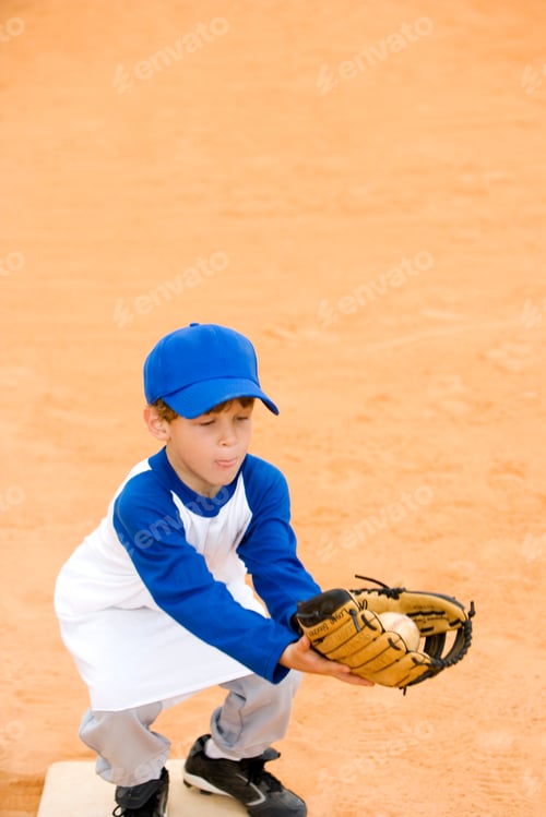 Preview: Young Boy Catching A Baseball