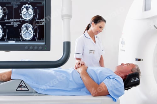Preview: A Nurse Is Comforting A Patient Laying On The City Scan Machine