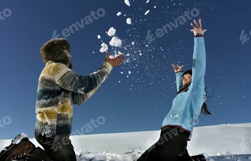 Preview: Mid Adult Couple Playing In Snow