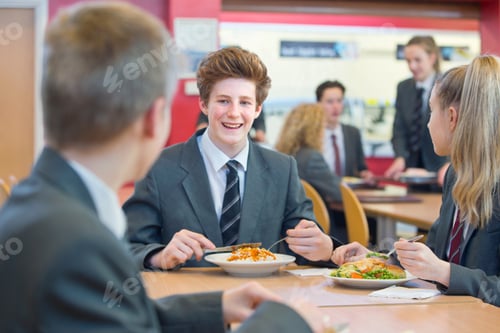 Preview: High School Students In Uniforms Eating Lunch At The Cafeteria.