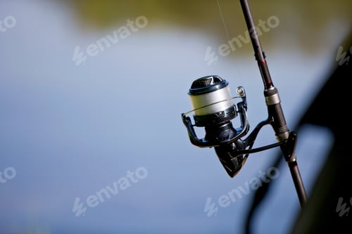 Preview: Horizontal Close Up Shot Of Fishing Rod And Line Against The Lake