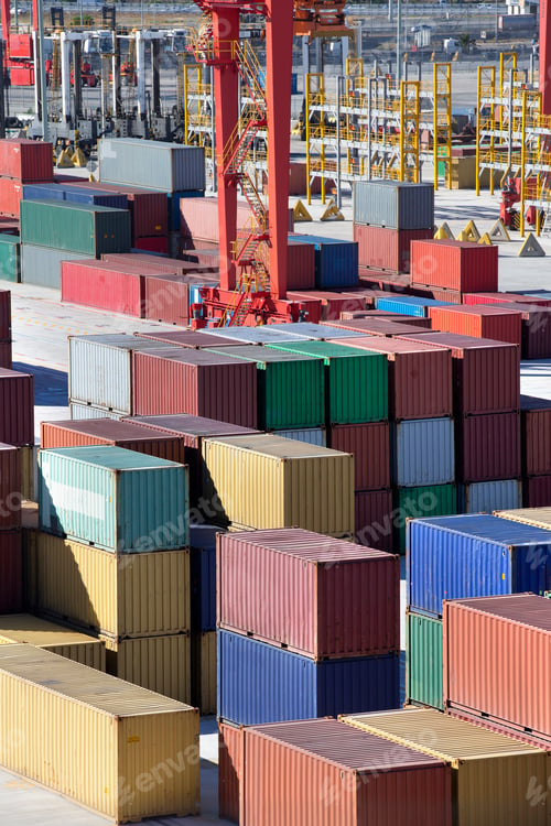 Preview: Vertical Shot Of Multicolored Cargo Containers Stacked At A Commercial Dock.