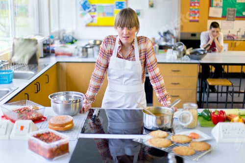 Preview: Portrait Shot Of A Frustrated Home Economics Teacher Cooking In A Kitchen Classroom.