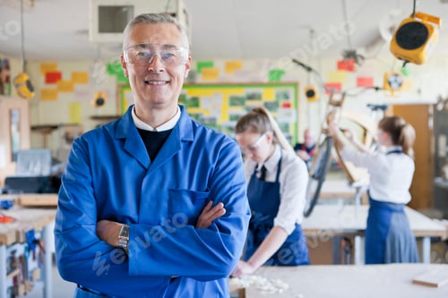 Preview: Portrait Shot Of A Teacher Standing In A Shop Class Workshop.
