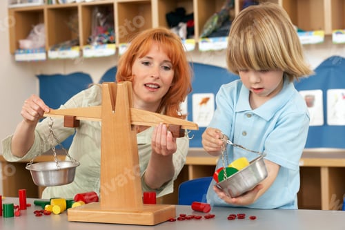 Preview: A Woman Teaching A Child How To Use A Weighing Balance.
