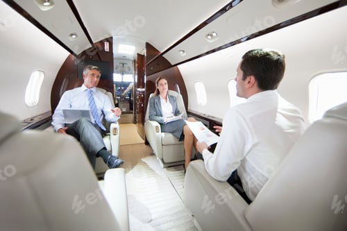 Preview: Business Employees Having A Meeting While Sitting In A Private Jet