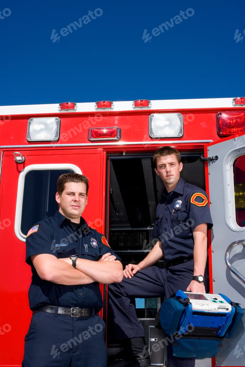 Preview: Paramedic And Colleague By Open Door Of Ambulance, Portrait, Low Angle View