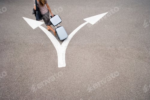 Preview: Overhead Shot Of A Businesswoman Walking With Luggage In Car Park Towards One Side Of Opposing