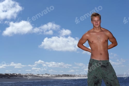 Preview: Wide Shot Of A Shirtless Male With A Cloudy Sky And The Sea In The Background.