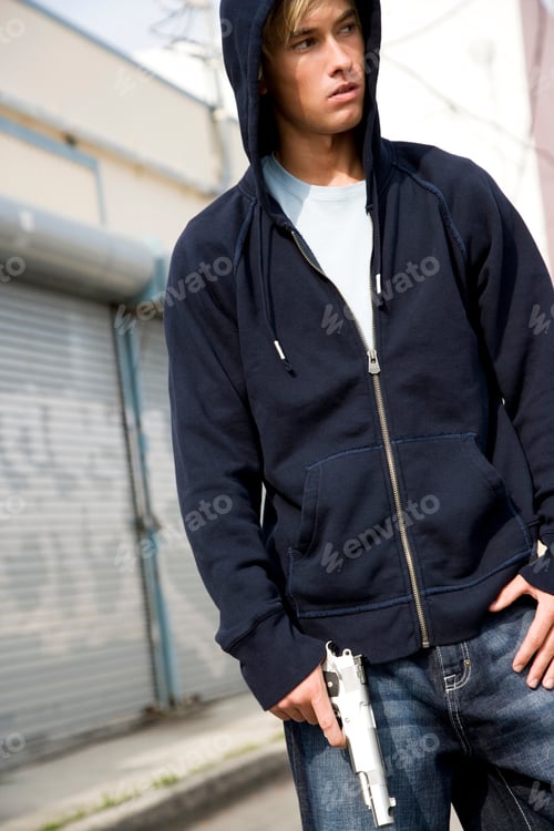Preview: Portrait Of A Young Man Holding A Gun