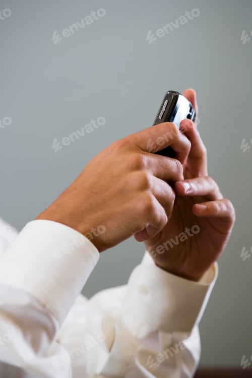 Preview: Close Up Of A Man Using A Mobile Phone To Sms Test Message
