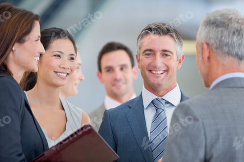 Preview: Portrait Of A Smiling Businessman Standing Among Co-Workers