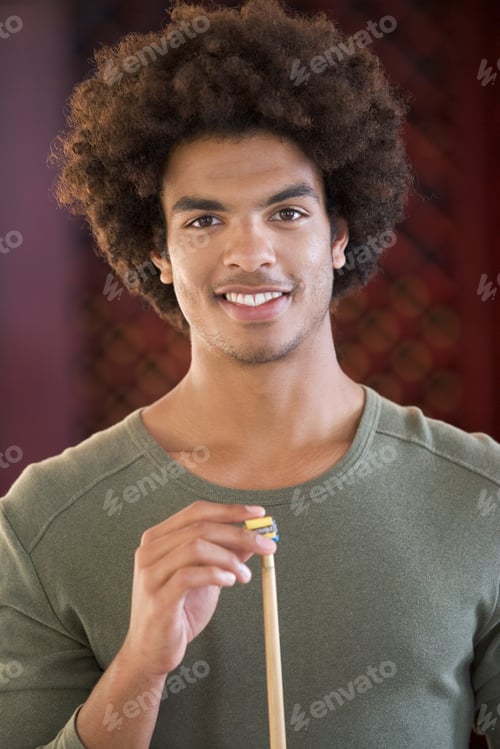Preview: A Young Man Playing Pool