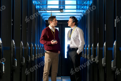 Preview: Medium Shot Of A Manager And Technician Having A Discussion In The Aisle Of A Server Room At A Data