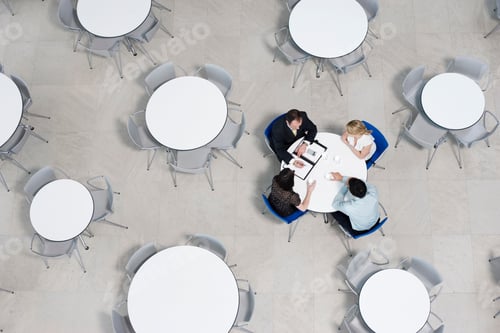 Preview: Overhead View Of Informal Business Meeting At Table Of Staff Canteen