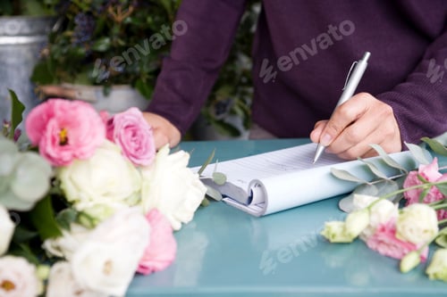 Preview: Woman Florist Taking An Order Over The Telephone