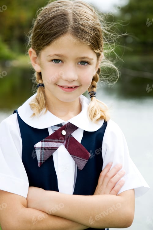 Preview: Smiling Girl with Braids Wearing School Uniform