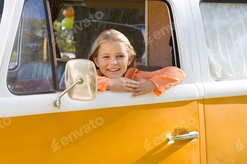 Preview: Girl Looking Out Of Camper Van Window On Family Vacation