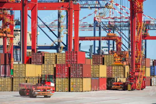 Preview: Commercial Harbor With Cranes Loading Cargo Containers Onto Trucks.