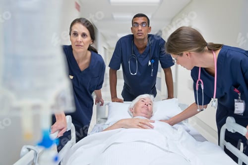 Preview: Emergency Medical Team Wheeling The Patient Along The Hospital Corridor