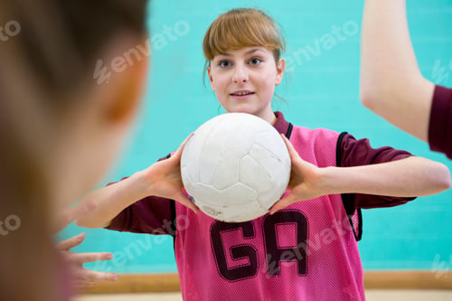 Preview: High School Student Holding A Netball During A Match In A Gym Class.